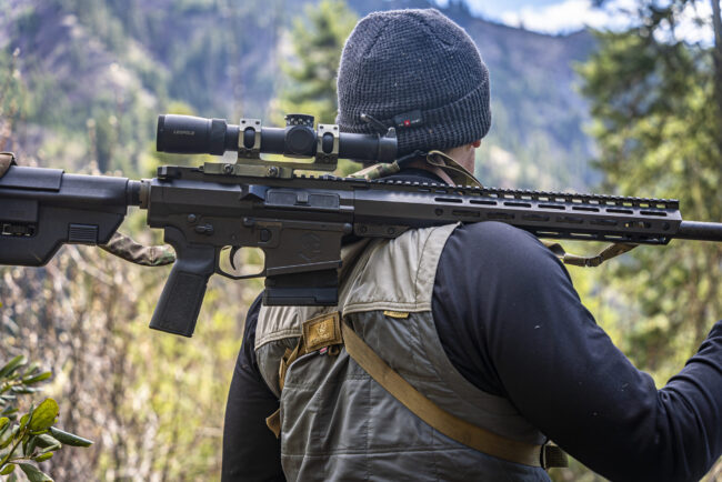 Caleb with mitchell defense rifle